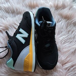 New Balance Black Sneakers with Yellow and Blue Highlights